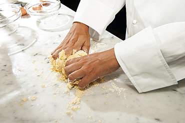 Working with fresh egg pasta by hand. Italy