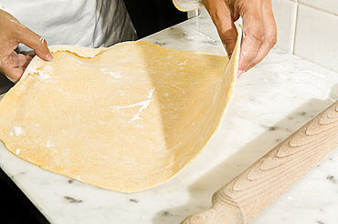 Working with fresh handmade pasta Pansoti, typical of Liguria. Italy