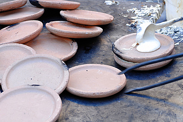 Panigaccio is a type of round, unleavened bread, baked in a special terracotta and mica dish, called testo, red-heated over high heat in a bonfire or in a wood-burning oven. A batter of flour, water and salt is interposed between one text and another, to form a pile. It is typical of the Lunigiana land on the border between Liguria and Tuscany, Italy, Europe