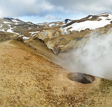 Hikers in the geothermal area Hveradalir in the mountains Kerlingarfjoell in the highlands of Iceland. Europe, Northern Europe, Iceland, August