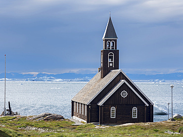 Zions church. Town Ilulissat at the shore of Disko Bay in West Greenland, center for tourism, administration and economy. The icefjord nearby is listed as UNESCO world heritage. America, North America,