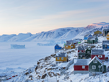 Town Uummannaq during winter in northern Greenland. Background is Nussuaq (Nugssuaq) peninsula. America, North America, Denmark, Greenland