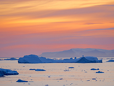 Ilulissat Icefjord also called kangia or Ilulissat Kangerlua, sunset over Disko Bay. The icefjord is listed as UNESCO world heritage. America, North America, Greenland, Denmark