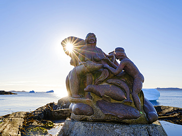 Mother of the sea, Sassuma Arnaa - a legendary figure in Inuit culture. Sculpure by Christian Rosing in the colonial harbour Nuuk the capital of Greenland during late autumn. America, North America, Greenland, danish terriotory