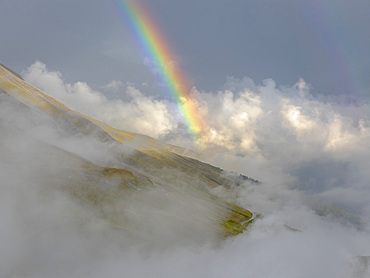 Landscape with rainbow and clouds in the National Park Hohe Tauern (High Tauern) near Franz-Josephs-Hoehe. Europe, Austria, Carinthia