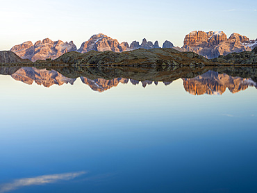 The summits of Brenta mountain range are reflected in Lago Nero. Brenta group in the Dolomites, part of UNESCO world heritage The Dolomites. Europe, Italy, Val Rendena