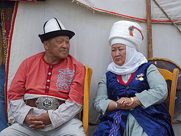 Participant in traditional garb. Folk Festival commemorating the origin myth the Tien Shan Maral (Tian Shan wapiti), an origin myth of the Kyrgyz tribes. Near Tasch Baschat, Naryn region. Asia, Central Aisa, Kyrgyzstan