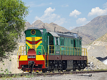 Railway for transporting coal. Town Tasch Kumyr, a coal mining area in the Tien Shan or heavenly mountains. Asia, Central Asia, Kyrgyzstan