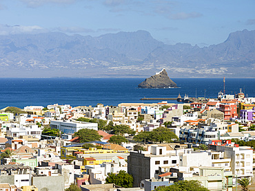 Cityview and view over the harbor towards Ilheu dos Passaros (bird island) and Santo Antao. City Mindelo, a seaport on the island Sao Vicente, Cape Verde in the equatorial atlantic. Africa, April