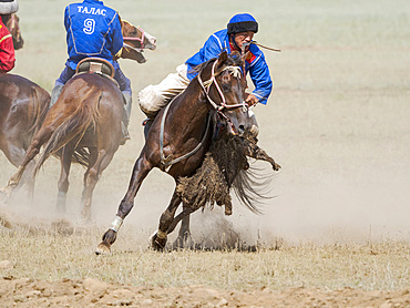 Kok Boru (Buzkashi), traditional equestrian team sport. Festival on the Suusamyr plain commemorating Mr Koshkomul, a sportsman and folk hero of the last century. Kok Boru is listed as UNESCO Intangible Cultural Heritage Asia, central asia, Kyrgyzstan