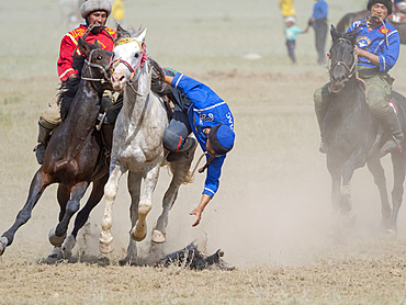 Kok Boru (Buzkashi), traditional equestrian team sport. Festival on the Suusamyr plain commemorating Mr Koshkomul, a sportsman and folk hero of the last century. Kok Boru is listed as UNESCO Intangible Cultural Heritage Asia, central asia, Kyrgyzstan