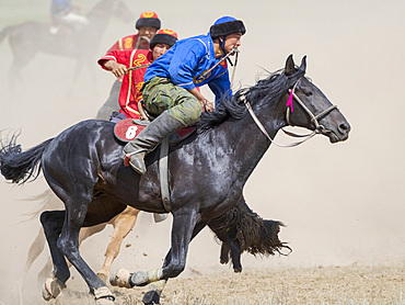 Kok Boru (Buzkashi), traditional equestrian team sport. Festival on the Suusamyr plain commemorating Mr Koshkomul, a sportsman and folk hero of the last century. Kok Boru is listed as UNESCO Intangible Cultural Heritage Asia, central asia, Kyrgyzstan