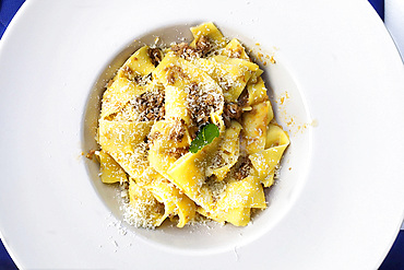 Pappardelle pasta with wild boar sauce and grated Tuscan pecorino cheese, Tuscay, Italy, Europe