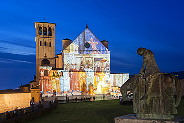 Via Cardinale Raffaele Merry del Val street, Christmas illuminations, Video Mapping of Giotto's Frescoes in the Facade of the Basilica of San Francesco church, Assisi, Umbria, Italy, Europe