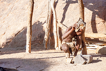 Craftsman of Tribu 'Damara at work, UNESCO World Heritage Site, Twyfelfontein, Damaraland, Namibia, Africa