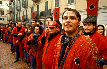 "Asso di Picche" squad after the battle, Traditional carnival, Ivrea, Piemonte, Italy