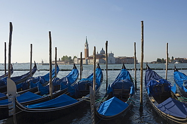 Moored gondolas and the island church of San Giorgio Maggiore, Venice, UNESCO World Heritage Site, Veneto, Italy, Europe