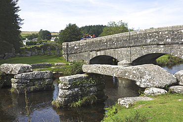 Clapper Bridge, mid span missing, and Dart Bridge, Belever Forest, near Postbridge, Dartmoor National Park, Devon, England, United Kingdom, Europe