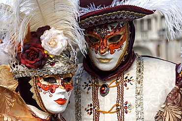 Lady and gentleman in red and white masks, Venice Carnival, Venice, Veneto, Italy, Europe