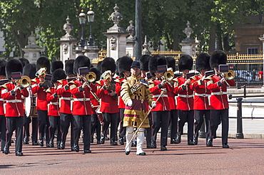 Guards Military Band marching past Buckingham Palace en route to the Trooping of the Colour, London, England, United Kingdom, Europe