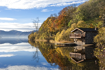 Boathouse and reflections, Lake Ullswater, Lake District National Park, Cumbria, England, United Kingdom, Europe