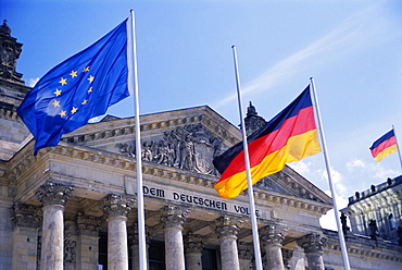 Exterior of the Reichstag building and flags, Berlin, Germany, Europe