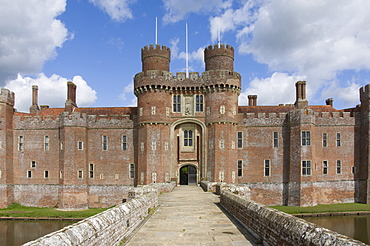 Across the causeway to the main entrance to the 15th century Herstmonceux Castle, East Sussex, England, United Kingdom, Europe