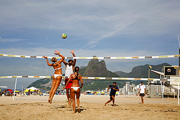 Women playing volleyball on Ipanema beach, Rio de Janeiro, Brazil, South America