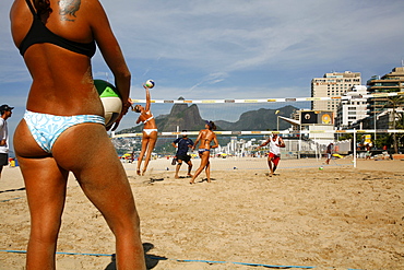 Women playing volleyball on Ipanema beach, Rio de Janeiro, Brazil, South America