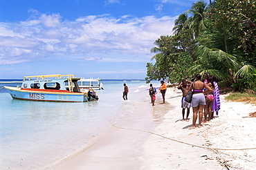 Tourists boarding a glass bottom boat at Pigeon Point, Tobago, West Indies, Caribbean, Central America