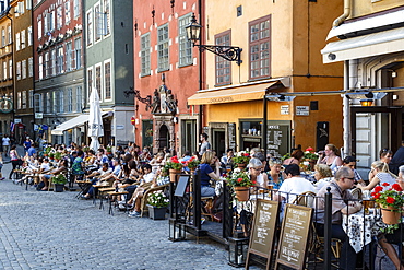 People sitting at a restaurant in Stortorget square in Gamla Stan, Stockholm, Sweden, Scandinavia, Europe