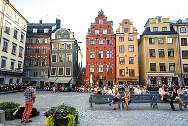 People sitting at Stortorget square in Gamla Stan, Stockholm, Sweden, Scandinavia, Europe