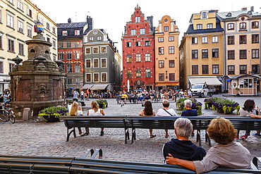 People sitting at Stortorget square in Gamla Stan, Stockholm, Sweden, Scandinavia, Europe