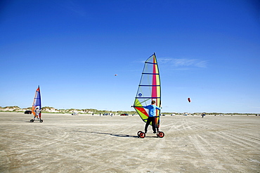 People windskating at Lakolk beach in Romo, Jutland, Denmark, Scandinavia, Europe