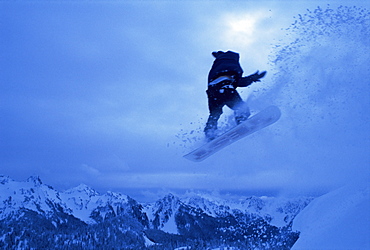 Snowboarder heads down, Paradise area, Mount Rainier, Washington State, United States of America (U.S.A.), North America