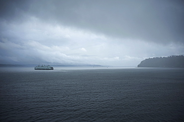 A ferry boat moves through stormy weather from Vashon Island to West Seattle. Washington State, United States of America, North America