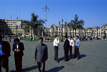 Business people talking on the Plaza de Armas, Lima, Peru, South America