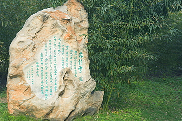 Rock with Chinese writings and bamboo forest, Purple Bamboo Park, Beijing, China, Asia