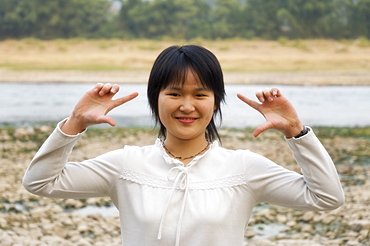 Portrait of young Chinese woman, Yangshuo, Guangxi Province, China, Asia