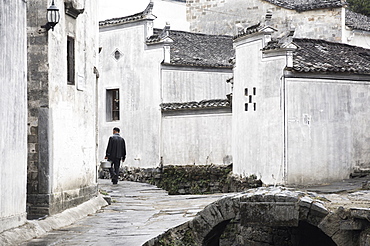 Man walking in the street, Xi Di (Xidi) village, UNESCO World Heritage Site, Anhui Province, China, Asia