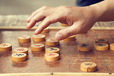 Chinese chess board and player's hand, Huangshan City (Tunxi), Anhui Province, China, Asia