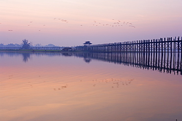 U Bein's Bridge across Thaungthaman Lake, at 1.2 km long the world's longest teak bridge, Amarapura, Myanmar (Burma), Asia