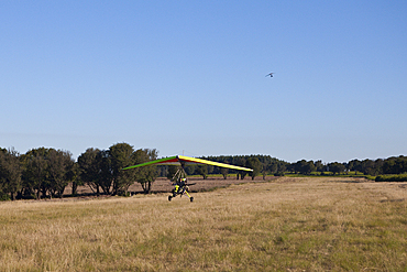 Tourists flying with ultralight trike, Mbotyi, Eastern Cap, South Africa