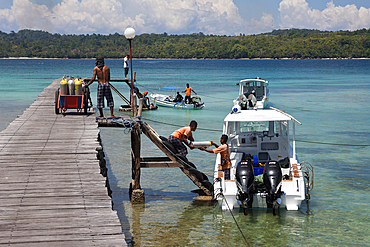 Loading Scuba Tanks on Diving Boat, Ambon, Moluccas, Indonesia