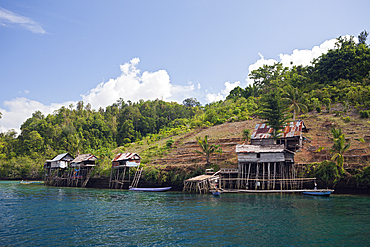 Traditional Houses built on Stilts, Gam, Raja Ampat, West Papua, Indonesia