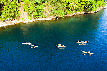 Residents in Outrigger Canoe, Tufi, Cape Nelson, Papua New Guinea