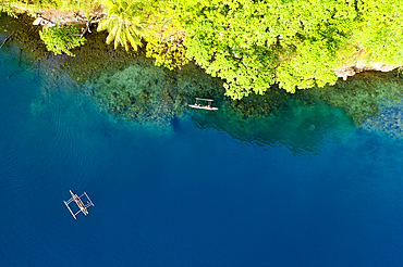 Residents in Outrigger Canoe, Tufi, Cape Nelson, Papua New Guinea