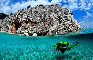 scuba diver and coast, split image, Italy, Medterranean Sea, Sardinia