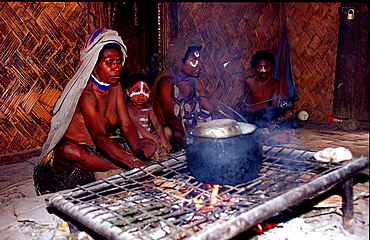 Huli woman cook in her hut, Papua New Guinea, Tari, Huli, Highlands