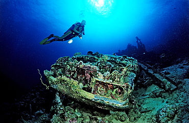 Scuba diver and car wreck near Blue Belt shipwreck, Sudan, Red Sea, Africa